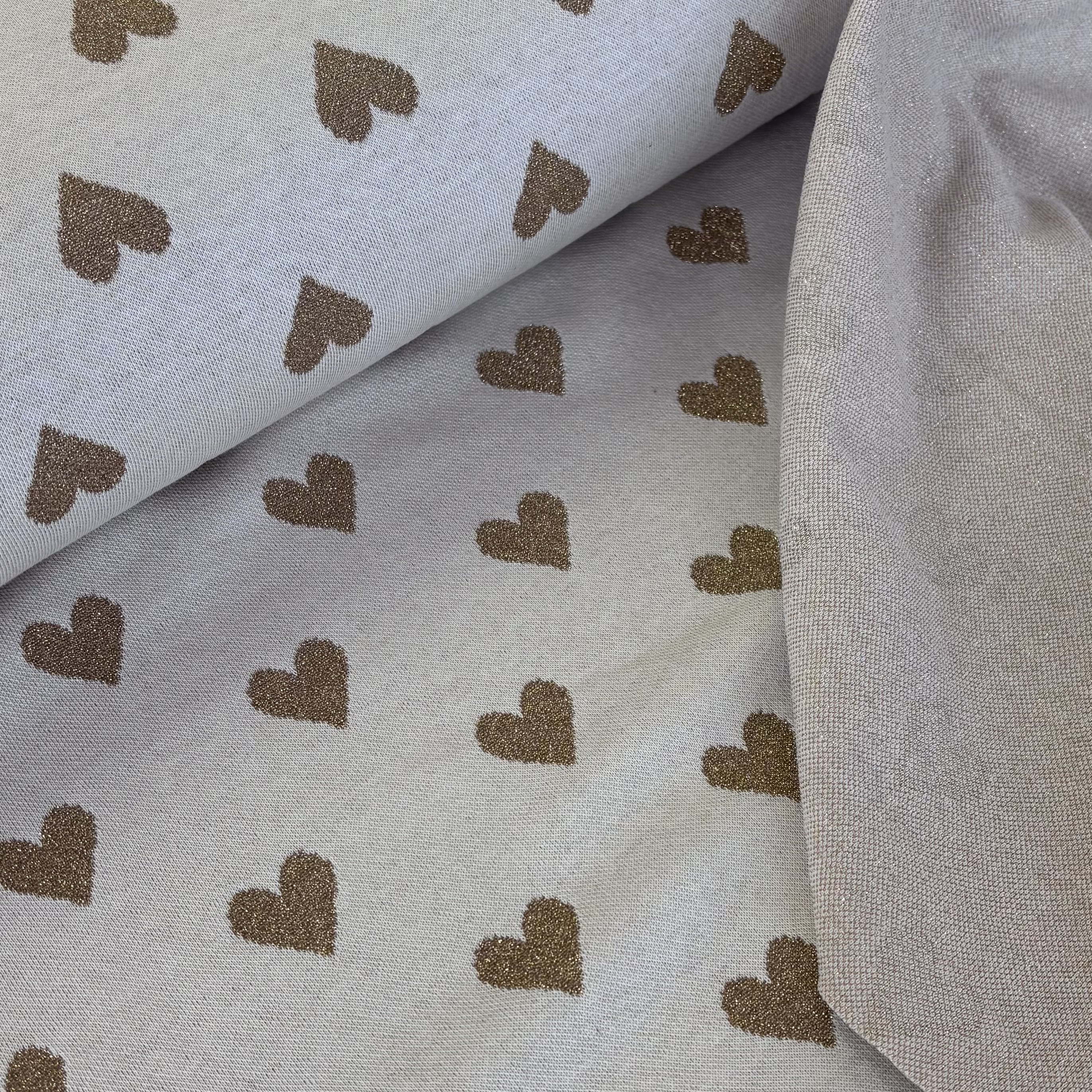 Strickstoff ecu mit goldenen Herzen 